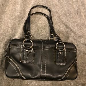 Black leather COACH bag with silver hardware.